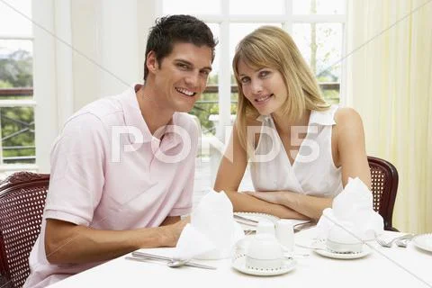 Young Couple Enjoying Hotel Meal Stock Photos