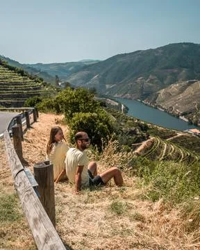 Young couple enjoying the view on vineyards of Douro valley Stock Photos