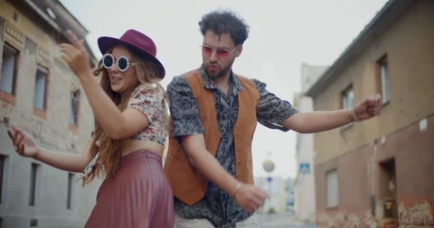 Young couple enjoys dancing together on street 스톡 동영상 252539841