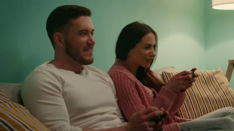 Young Couple Enjoys Playing Computer Games Stock-Footage 164420661