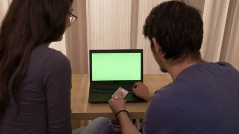 Young couple experiencing issues with credit card while doing online shopping Stock Footage 83046002