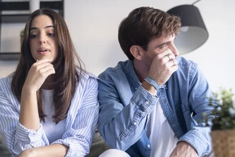 Young couple experiencing relationship problems and conflict, with the man .. Stock Photos