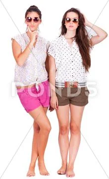 Young couple female friends laughing on white Stock Photos
