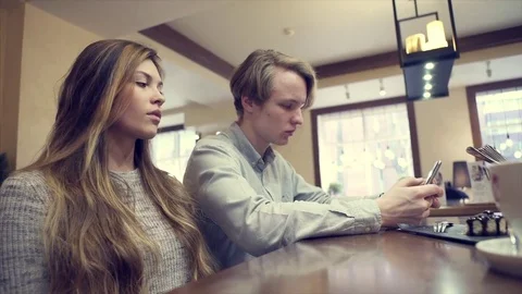 Young couple fighting, while sitting in cafe Stock Footage 70909925