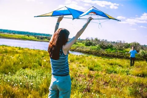 Young couple flying a kite Stock Photos