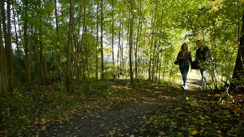 Young couple follow the path in the forest Stock Footage 81768842