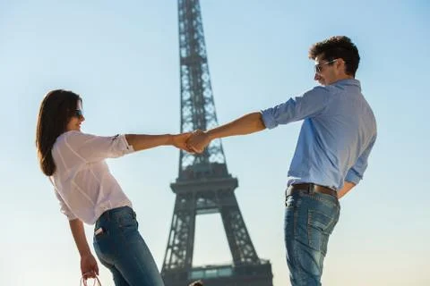 Young couple in front of  Eiffel Tower, Paris, France Stock Photos