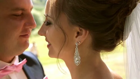 Young couple gently hugging. The wind drives the hair. Close-up Stockbeeldmateriaal 77187861