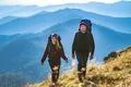 The young couple going to the mountain Photo