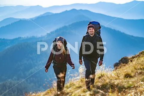 The young couple going to the mountain Stock Photos