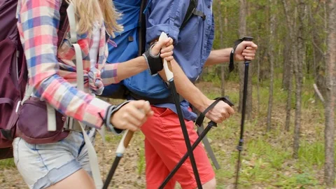 Young couple going for a walk in forest Видео 118535904