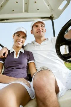 Young couple on golf Fotos de archivo