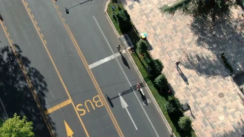 Young couple has fun, rides on longboard in middle of empty road . Stock Footage 238626507