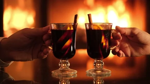 Young couple has romantic dinner with mulled wine over fireplace background. Stock Footage 166395377