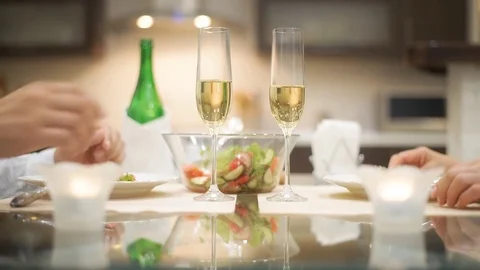 Young couple have romantic dinner with champagne. Stockbeeldmateriaal 77753068