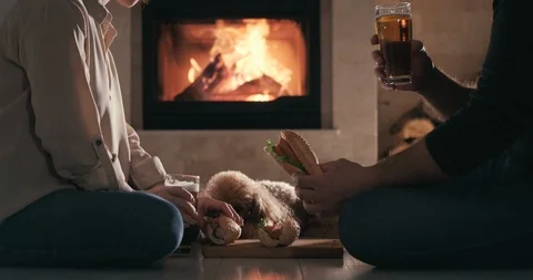 Young couple have romantic dinner with hot dogs and beer. Stock Footage 100413620