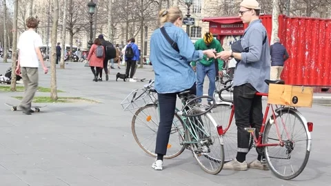 Young couple having argument while cycling in Paris, France Stock Footage 149305175