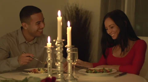 Young couple having a candle lit romantic dinner Stock Footage 44113808