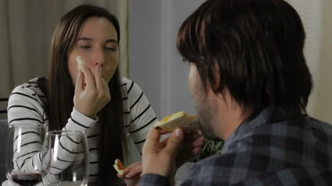 Young couple having date conversation at home with delivery pizza and red wine 스톡 동영상 148499982