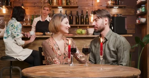 A young couple having a date in a vintage cafe Stock Footage 103100634
