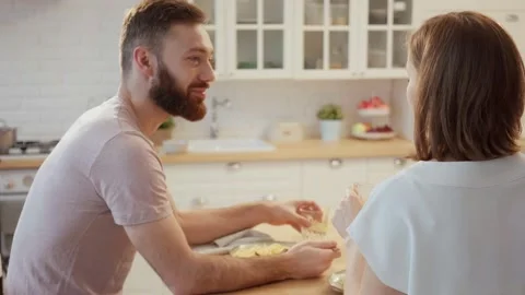Young couple having dinner eating pasta at home Stock Footage 146278149