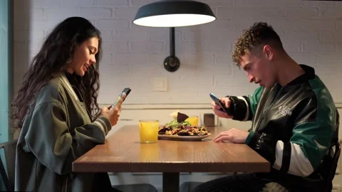 Young couple having dinner in a restaurant Stock-Footage 288237644