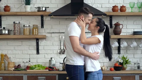 Young couple having fun and dancing at the kitchen. Stock Footage 105411348