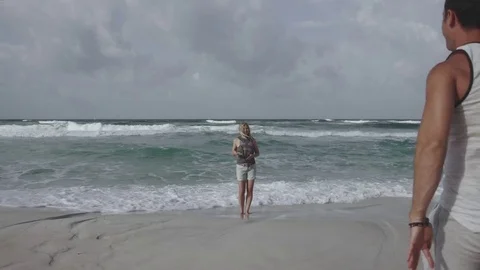 Young couple having fun on beautiful exotic beach 4k Stock-Footage 81589172