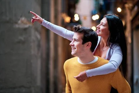 Young couple having fun on a date together outdoors. Stock Photos