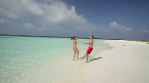 Young couple having fun on deserted island Stock Footage 10788273