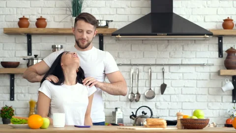Young couple having fun at the kitchen. Stock Footage 105409996