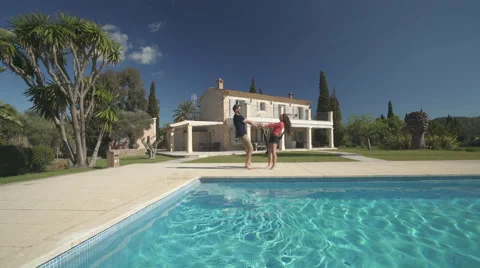 Young couple having fun on private property, wide angle Stock Footage 62692608
