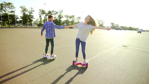Young couple having fun with scooter Stock-Footage 74691284