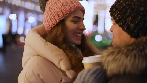 Young couple having fun on street in winter. Steadicam shot, slow motion Stock Footage 101863196