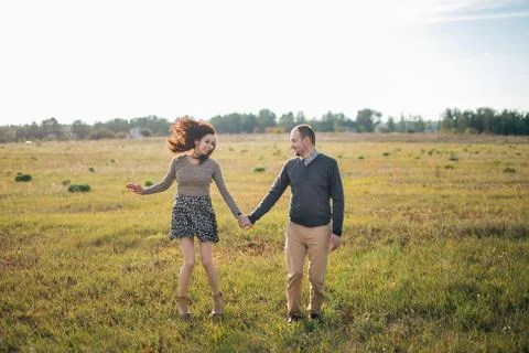 Young couple having fun at sunset Stock Photos