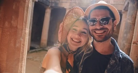 Young couple having fun taking selfies at Greek classical monument Stock Footage 90209486