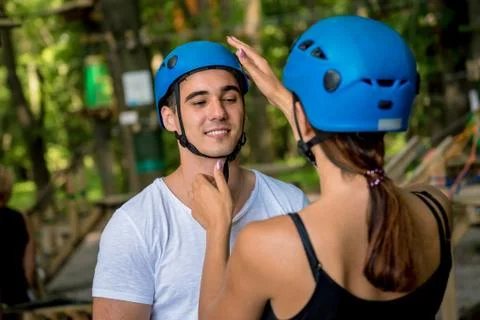 Young couple having fun time in adventure rope park. Stock Photos