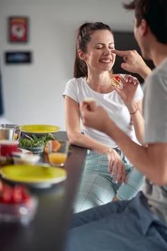A young couple having fun while having breakfast at home. Couple, love, break Stock Photos
