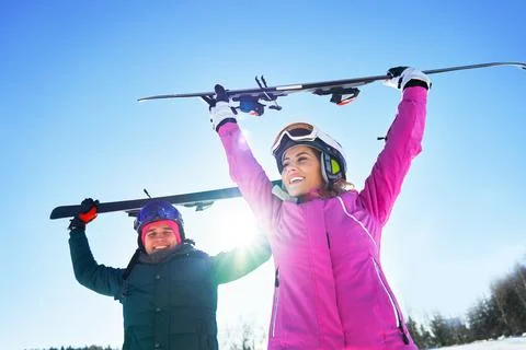 Young couple having fun while winter skiing Stock Photos