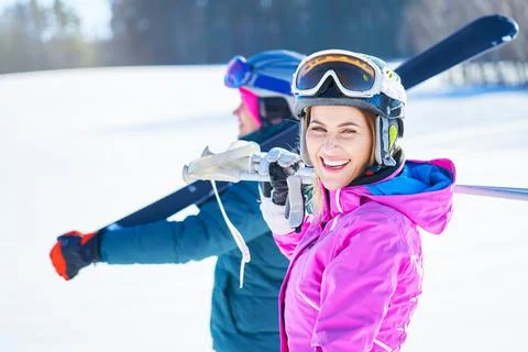 Young couple having fun while winter skiing Stock Photos