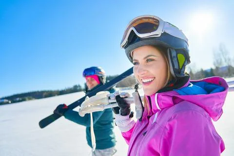 Young couple having fun while winter skiing Stock Photos