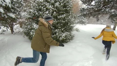 Young couple having fun in winter park Video stock 102339881