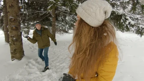 Young couple having fun in winter park Video stock 102339888