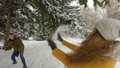 Young couple having fun in winter park Video stock 102339899