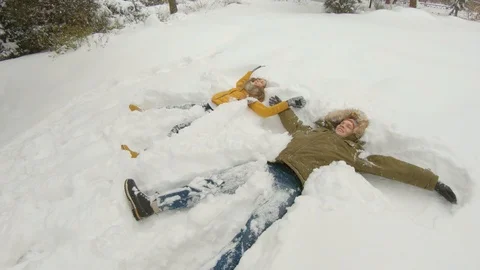 Young couple having fun in winter park Stock Footage 102339928