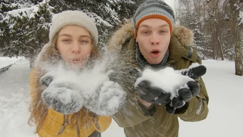 Young couple having fun in winter park Video stock 102339945