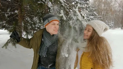 Young couple having fun in winter park Video stock 102339947