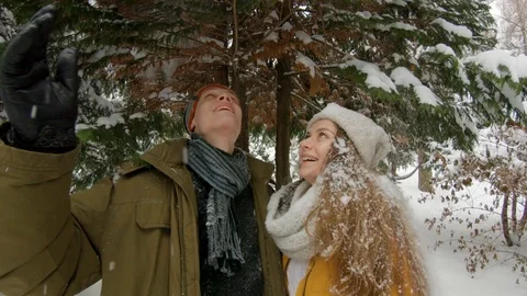 Young couple having fun in winter park Video stock 102339955