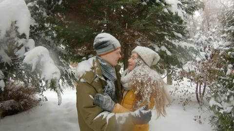 Young couple having fun in winter park Video stock 102339965