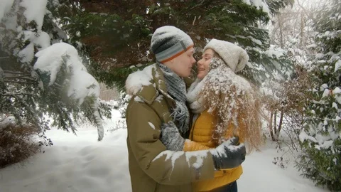Young couple having fun in winter park Video stock 102339992